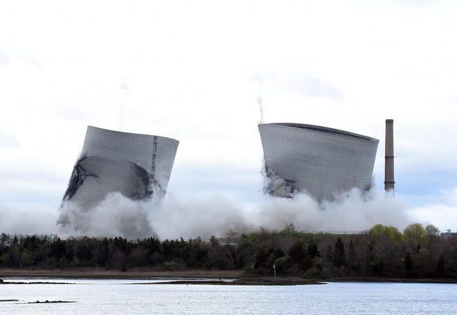 Within seconds, the dreaded cooling towers were gone. [Herald News File Photo]