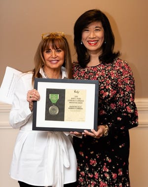Andrea Jung, right, president and CEO of Grameen America, presented the Mary S. Peake Award for Innovation to the Blackstone Valley Chamber of Commerce Tuesday, Nov. 26, 2019. [Submitted Photo]