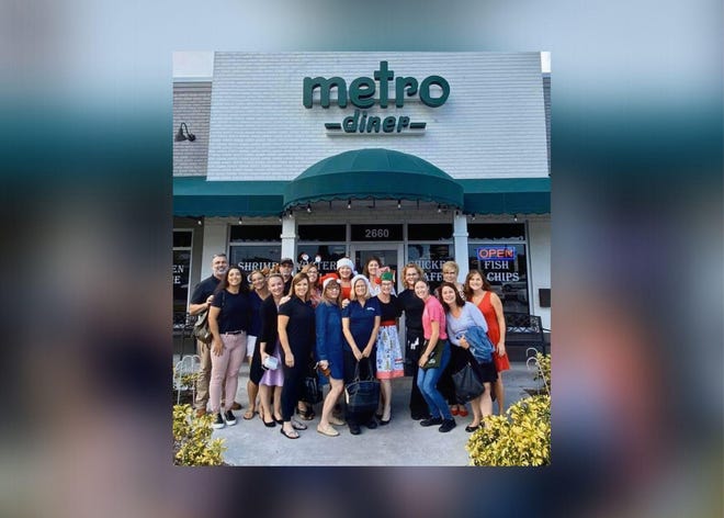 A group of 17 Treasure Coast residents surprised two Metro Diner servers with a generous $850 tip for Christmas after having lunch at the restaurant in Stuart on Wednesday, Dec. 11. [Photo: USATHO]