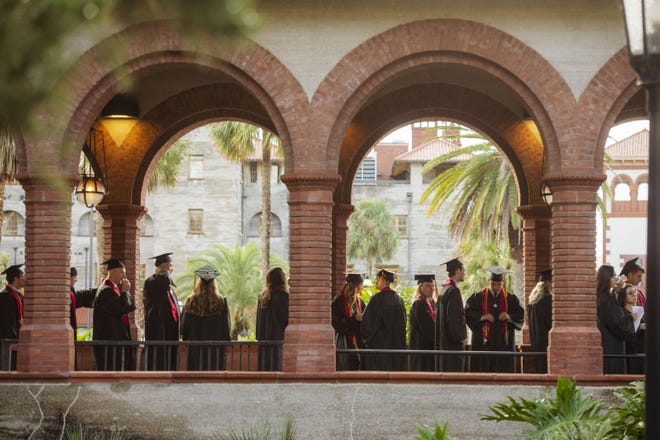 Graduates of the Fall 2019 class line up to receive their diplomas from Flagler College. [CONTRIBUTED/ZACH THOMAS]