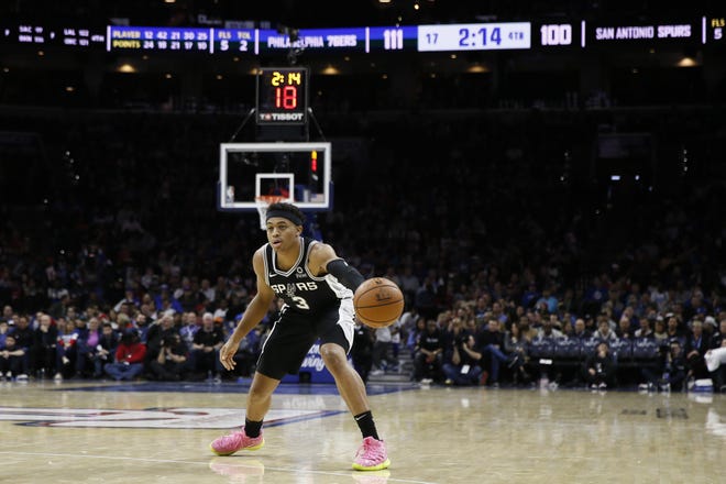 Keldon Johnson, seen here during an NBA game against the Philadelphia 76ers in November, led the Austin Spurs in a loss to Wisconsin on Tuesday. [Matt Slocum/The Associated Press]
