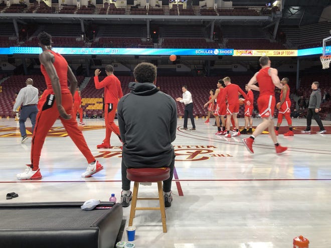 Ohio State sophomore Duane Washington Jr. watches his teammates warm up before Sunday's game at Minnesota's Williams Arena. Washington missed the game with a rib injury.
