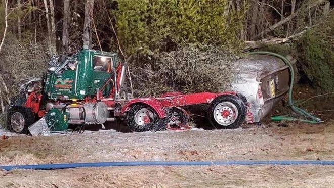 A 2018 Mack truck came to a stop off Route 101 in Epping Monday night after being struck by a car, causing a fuel spill of more than 5,000 gallons from a tanker towed by the truck, according to police. [N.H. State Police photo]