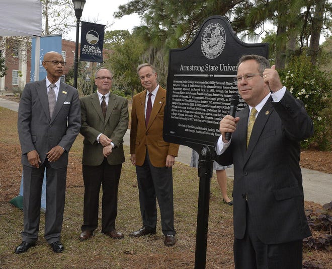 Kyle Marrero, right, president of Georgia Southern University, reads the historical marker that was unveiled Tuesday on the Armstrong Campus. Participating in the unveiling were l-r former Mayor Otis Johnson, W. Todd Groce, President and CEO of the Georgia Historical Society and Don Waters, chairman of the Georgia Board of Regents.  [Steve Bisson/savannahnow.com]