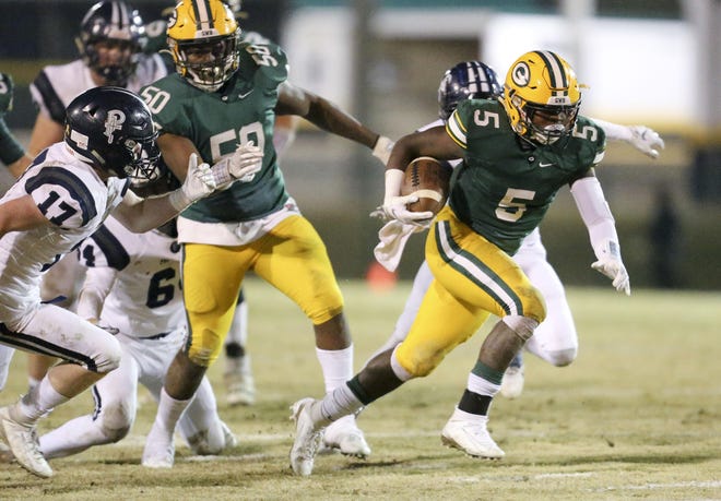 Gordo's Troy Garner (5) breaks through the Providence Christian line and into the open field during the Greenwave’s Class 3A, second-round playoff game on Nov. 19, 2019. Gordo has been moved up to Class 4A for next season. [File Staff Photo/Gary Cosby Jr.]