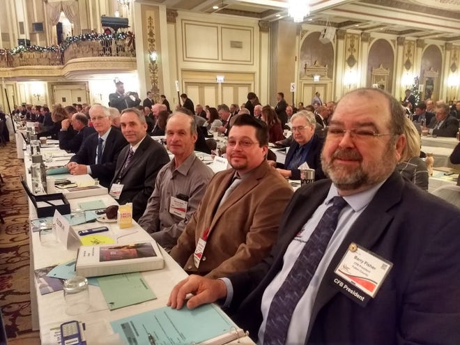 FCFB President Barry Fisher (far right) is joined by our other 3 Voting Delegates at the IAA Annual Meeting. Next to Barry are Delson Wilcoxen, Wayne Ridle, and Raymond Porter (past Raymond is a Delegate from Peoria County whom we were seated next to). [Courtesy Fulton County Farm Bureau]