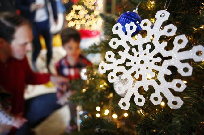Ornaments on a Christmas tree attracted children at Snowflake Castle at the Everal Barn and Homestead in Westerville on Saturday, December 8, 2018. [Fred Squillante/Dispatch]