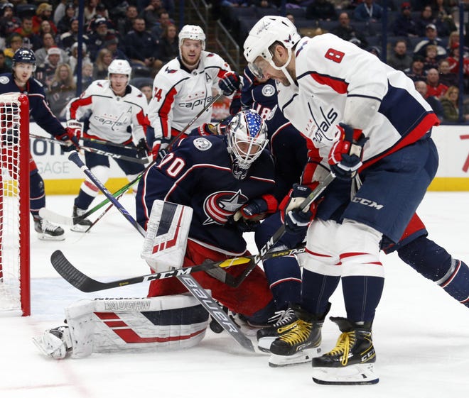Goalie Joonas Korpisalo stops a shot by the Capitals' Alex Ovechkin during the Blue Jackets' 3-0 win Monday. [Paul Vernon/The Associated Press]