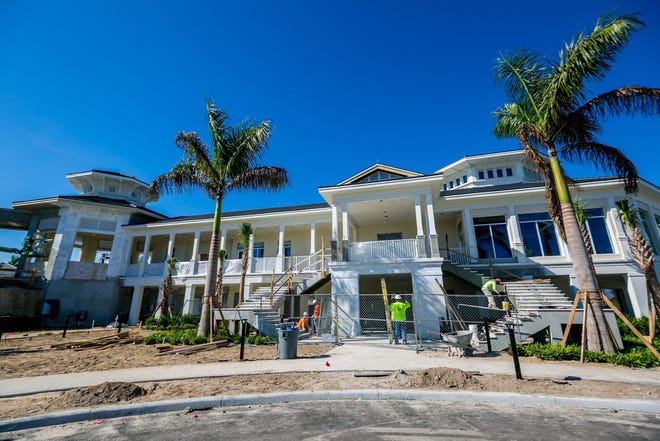 The new clubhouse at the North Palm Beach Country Club, nearing completion in this October photo, will open to the public on Saturday. [RICHARD GRAULICH/palmbeachpost.com]