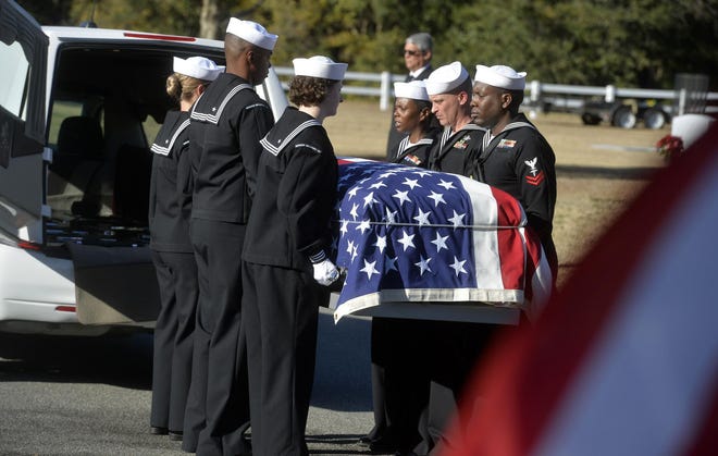 Sailors carry the casket of Cameron Walters at Oak Hill Cemetery. [STEVE BISSON/SAVANNAHNOW.COM]