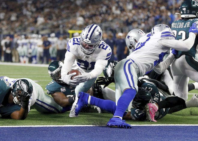 Cowboys running back Ezekiel Elliott stretches to score a touchdown against the Eagles in October. [RON JENKINS / ASSOCIATED PRESS]