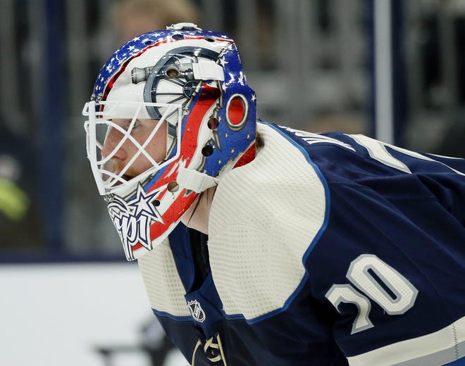 Columbus Blue Jackets goaltender Joonas Korpisalo (70) warms up with a new helmet prior to the NHL game against the Montreal Canadiens at Nationwide Arena in Columbus on Wednesday, Nov. 20, 2019. The Blue Jackets won 5-2. [Adam Cairns/Dispatch]