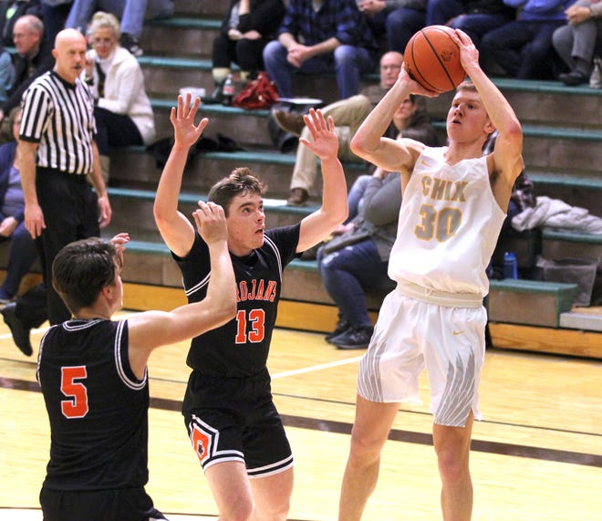 Zeeland East's Trip Riemersma (right) shoots against Middleville on Friday at Zeeland East. [Lenny Padilla/Sentinel contributor]