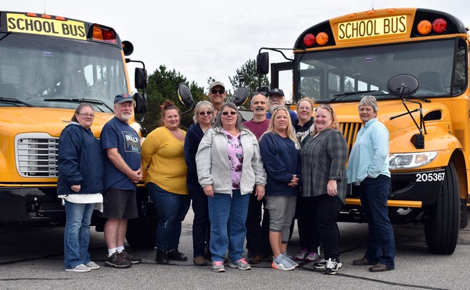 At the Ledgemere bus barn location in Wells are some of Ledgemereís bus drivers who transport Wells-Ogunquit CSD students. From left are Tammy Bissell, Paul Littlefield, Cassie Durham, Connie Hilton, Bill Grant, Jean LaRiviere, Maurice Viollette, Gene Sledzieski, Christine Towne, Rochelle Greenwood, Tabitha Bergeron and Lauren Clark. [Reg Bennett/file photo]