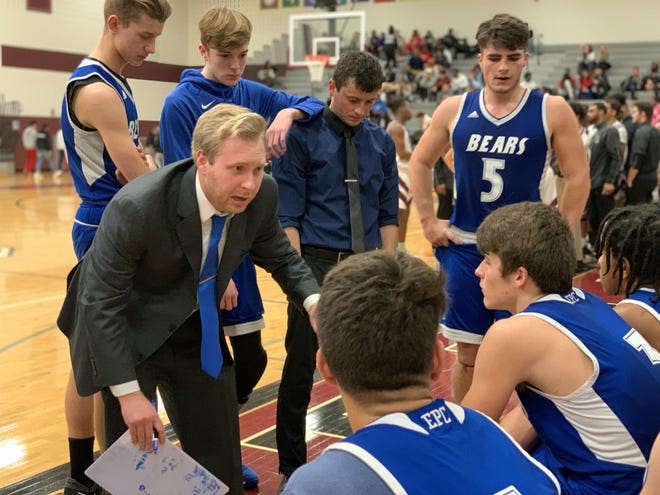 Pleasant Valley boys basketball head coach Bobby Hahn gives direction to his team during a timeout during the Bears game against Stroudsburg on Friday night. [Zach Sturniolo/POCONO RECORD]
