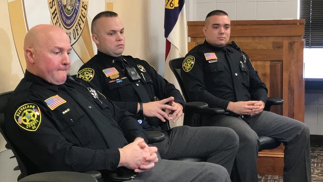Deputy Jimmy Ellis, Lt. Jody Seagle and Deputy Robert Tyler worked together to help rescue a man who crashed into Buffalo Creek Tuesday night. [Joyce Orlando/The Star]