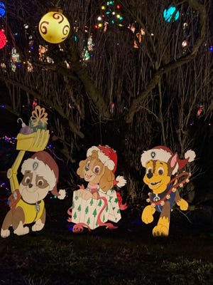 Pat Patrol is just one of approximately 85 cut out characters, 350 blow molds and 35,000 lights that can be seen at the Christmas display of Jim and Marilyn Page, 2200 Goshen Valley Drive SE. This is located on state Route 416 between New Philadelphia and the village of Tuscarawas. The family also collects non-perishable food items for Friends of the Homeless. (TimesReporter / Cindy Davis)