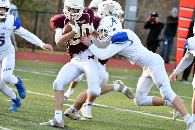 The Woolies were overmatched, but never quit in Millbury's game against Ashland Saturday, Nov. 23, 2019. In photo, Connor Quadnago tries to keep his balance during the state semi-final game. [Photo/Steve Balestrieri]
