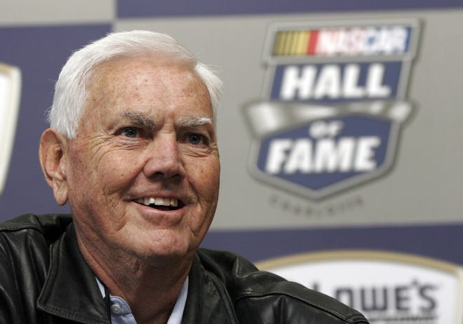 FILE - In this Oct. 16, 2009, file photo, former NASCAR driver and owner Junior Johnson smiles as he speaks to media about being named to the NASCAR Hall of Fame during a news conference at Lowe's Motor Speedway in Concord, N.C. Johnson, who won 50 NASCAR Cup Series races as a driver and 132 as an owner and was part of the inaugural class inducted into the NASCAR Hall of Fame in 2010, has died at 88. (AP Photo/Bob Jordan, File)