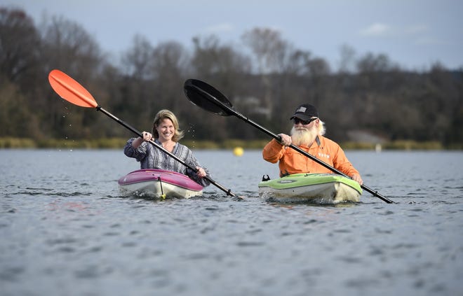 Veteran Truck Carlson, right, and Kimberly Bridi, with ForcesUnited, kayak along the Savannah River in Augusta, Ga., Wednesday afternoon December 11, 2019. [MICHAEL HOLAHAN/THE AUGUSTA CHRONICLE]