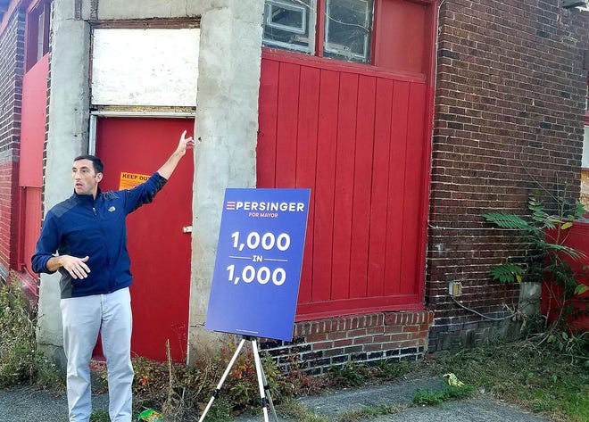 Then a Republican candidate for Erie Mayor, John Persinger stands outside 663 W. Fourth St. in September 2017 and announces his proposal to tear down or rehabilitate 1,000 city homes in 1,000 days. This property was acquired by the Our West Bayfront neighborhood organization and turned into Westerdahl Park. [MATTHEW RINK FILE PHOTO/ERIE TIMES-NEWS]