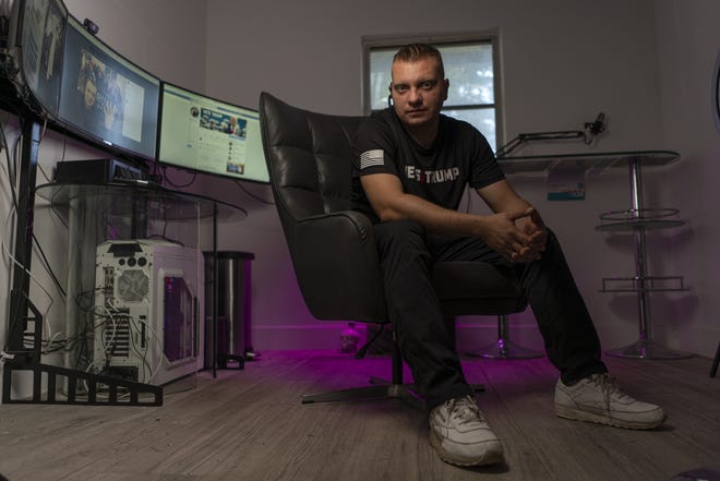 Vlad Lemets, an American veteran and co-founder of the "Vets for Trump" Facebook page, sits in his home office in Coral Springs, Florida. [Josh Ritchie for The Washington Post]