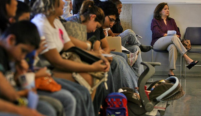 Texans wait in line to apply for food stamps and other assistance at the Texas Health and Human Services Commission offices in Austin in 2010. An investigation conducted by the U.S. Agriculture Department and several other federal agencies found Texas incorrectly received performance bonuses in 2010, 2013 and 2014 for its administration of the Supplemental Nutrition Assistance Program, or SNAP, after the state manipulated its error rate and submitted false data. [American-Statesman file]