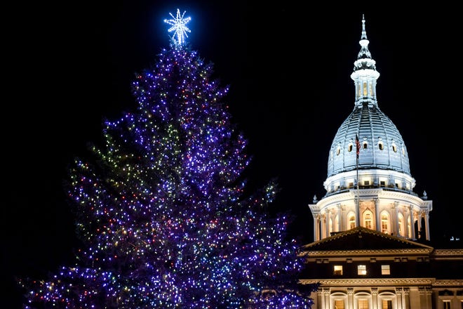 The official state tree is lit up in front of the Michigan State Capitol during the Silver Bells in the City event on Friday, Nov. 22, 2019, in downtown Lansing.



191122 Silver Bells 101a