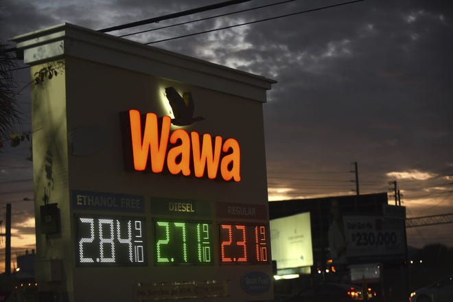 A sign at a Wawa convenience store and gas station seen on the day the company's CEO announced that the firm is investigating a massive data breach that has potentially affected all 800 of their locations. Malware discovered on Wawa payment processing servers on December 10, 2019 affected customers' credit and debit card information from March 4, 2019 until the breach was contained on December 12, 2019. [Photo by Paul Hennessy via AP]