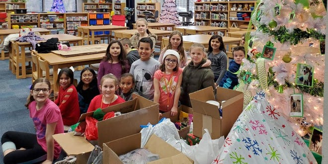 Hook Elementary is one of several groups that donated supplies to the Erath County Humane Society this holiday season.