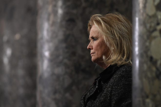 Rep. Debbie Dingell, D-Mich, speaks to reporters on Capitol Hill in Washington, on Dec. 18. [AP PHOTO/SUSAN WALSH]