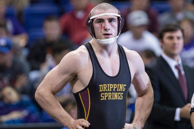 Dripping Springs Senior Luke Hodsden didn't let some blood get in the way of winning the gold medal in the 182-pound class in 2016 UIL state wrestling tournament. [PAUL BRICK FOR STATESMAN]