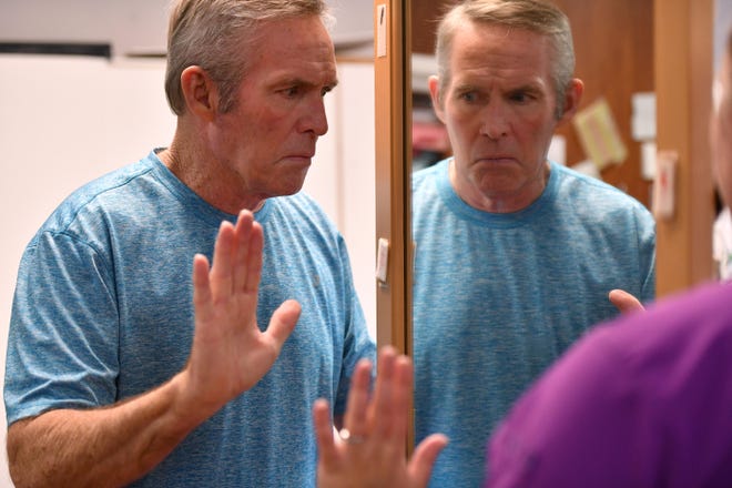 Jim Anderson exercises next to a mirror during a stroke recovery therapy session recently at the SMH Skilled Nursing & Rehab Center. Anderson, a former coach at Riverview High School, has suffered a series of strokes over the last several years. [Herald-Tribune staff photo / Mike Lang]