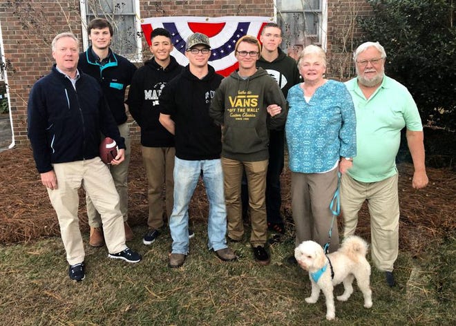 This group spent a fun Thanksgiving Day watching pro football on TV, playing bocce ball, throwing the football, and enjoying each other’s company as they ate a delicious turkey dinner at Al and Ginny Springer’s home. A lovely day was completed by having each Marine make their own turkey sandwiches to take back to the base. Left to right: Rick and Alton Russell (Ginny Springer’s son and grandson), Alexis Eusquiana, California; Keegan Lopeman, Kansas; Mason Walker, Texas; Darren Murray, Michigan; Ginny and Al Springer with Bo. [CONTRIBUTED PHOTO]