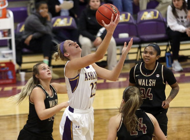 Ashland University's Sara Loomis (23) puts up a shot against Walsh University’s Lexie Scarton and Megan Ball during women's college women’s basketball action on Nov. 26 at Kates Gymnasium. Loomis is averaging 17.7 points per game this season.