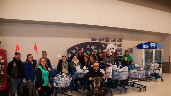 The Loyal Riders Motorcyle Club North Plains Chapter took five familes Christmas shopping on Sunday, Dec. 22, at the Ionia Meijer, 2770 S. State Road, in Ionia. [CONTRIBUTED]