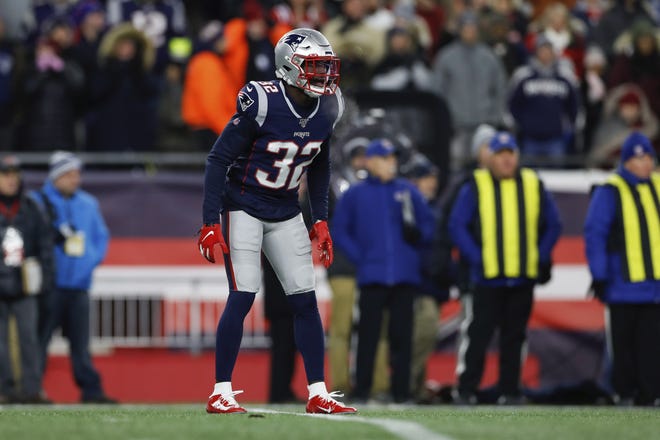 New England Patriots free safety Devin McCourty (32) is one of several players who try to strike a balance between family and work when the Christmas holiday rolls around. [Photo by AP]