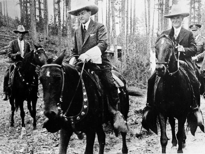 U.S. President Calvin Coolidge is on horseback to attend the dedication ceremony of the Mount Rushmore Memorial in South Dakota, Aug. 15, 1927. [THE ASSOCIATED PRESS]