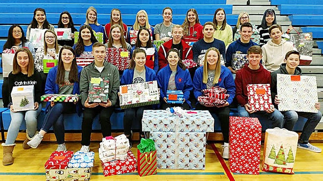 Mapleton Middle School and High School students partnered with Trinity Baptist Church for the 12th year to give gifts, coats, hats, gloves and dinner to several local families in need. The items were collected throughout December and were delivered the week of Dec. 16.