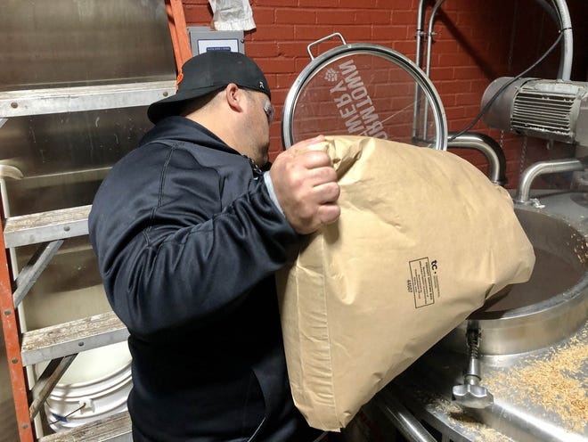 Mike Giangrande was at Wormtown Brewery last week brewing a beer in honor of his close friend, Worcester Fire Lt. Jason Menard. Worcester's Bravest will be released next month, with all proceeds of the sale going to the Menard family. [Photo/Matthew Tota]