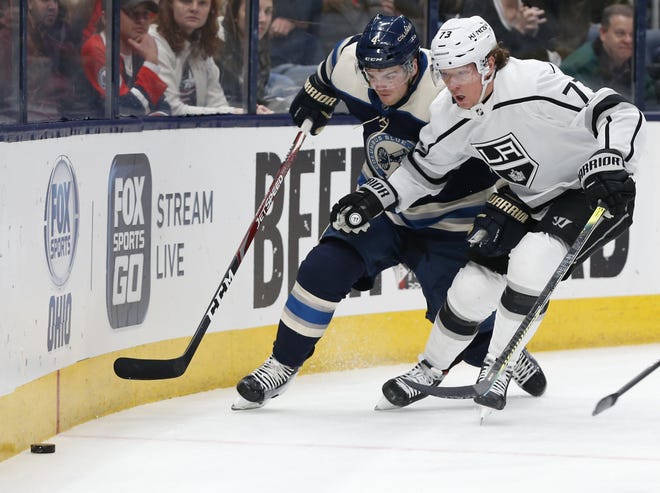 The Blue Jackets' Scott Harrington, left, has played in just 12 games this season. [Jay LaPrete/The Associated Press]