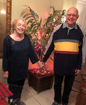 No Christmas tree? No problem. June and Jim Freeland of Minnesota decorated the artificial plant in their rented Okaloosa Island condominium to help put them in the Christmas spirit. [CONTRIBUTED PHOTO]