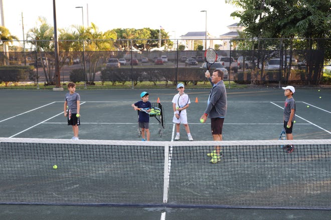 Former Australian Open tennis champion Johan Kriek, center, runs the Johan Kriek Tennis Academy at the North Palm Beach Tennis Center. The program includes full- and part-time academy training, home school and after-school training, high-performance training, camps and private lessons. [Contributed by Village of North Palm Beach]