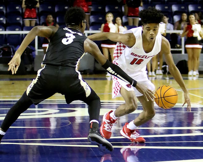 Northside's Jacob Joe looks to dribble around JT Robinson's Christian Cross during a fast break in the second quarter, Thursday, December 26, 2019, in the 42nd annual Coca-Cola Classic at UAFS Stubblefield Center. [JAMIE MITCHELL/TIMES RECORD]