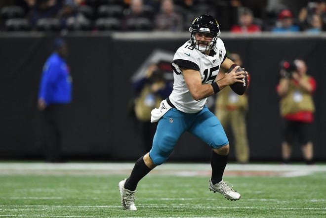 Jacksonville Jaguars quarterback Gardner Minshew II runs out of the pocket against the Atlanta Falcons during the first half Dec. 22 in Atlanta. [John Amis/The Associated Press]