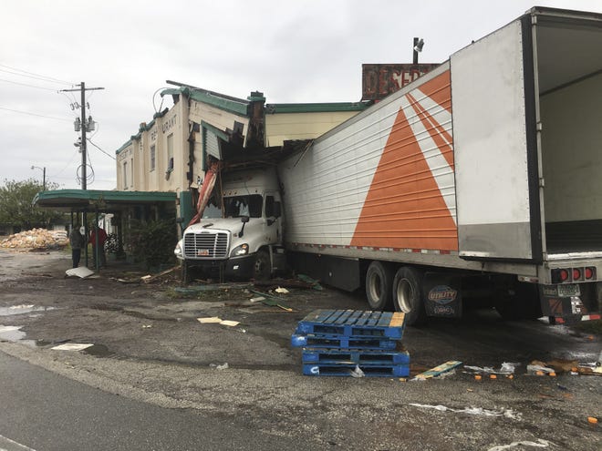 In a photo provided by the Florida Highway Patrol, a semitruck plowed into the historic Desert Inn in Yeehaw Junction south of Orlando, Fla., early Sunday, Dec. 22, 2019, causing major damage but no apparent injuries. The inn is the centerpiece of Yeehaw Junction, a tiny respite off Florida's Turnpike between South Florida and Orlando. [Florida Highway Patrol via AP]