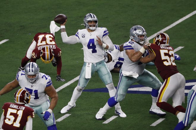 Dallas Cowboys quarterback Dak Prescott throws against the Washington Redskins during the Cowboys’ 47-16 win Sundau in Arlington. Prescott tossed four touchdowns to push the Cowboys’ season record to 8-8. [AP Photo/Roger Steinman]