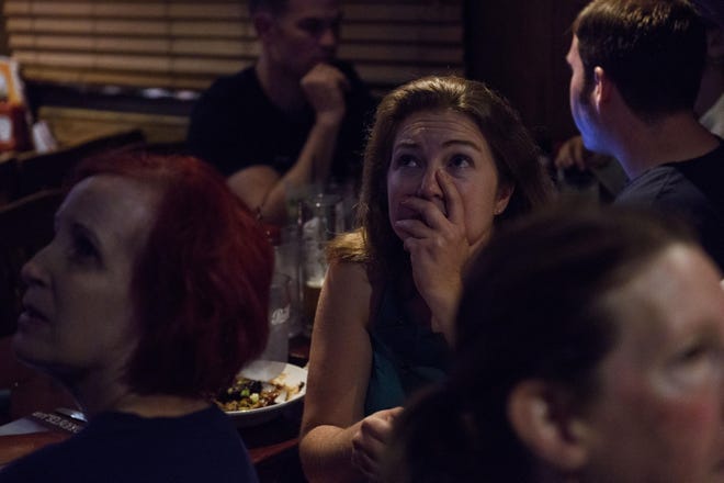 Sharon Toland watches as some district results come in after the special election for the 9th Congressional District on Sept. 10, 2019 at the Carolina Ale House during a watch party with fellow supporters of candidate Dan McCready. Dan Bishop defeated McCready. [Melissa Sue Gerrits/The Fayetteville Observer]
