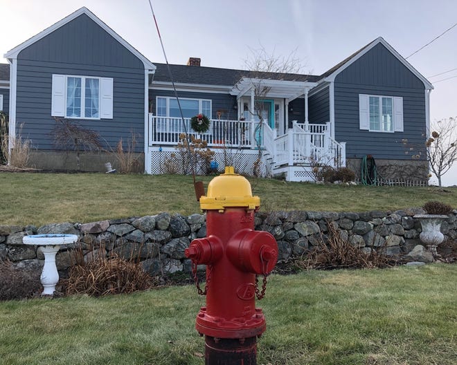 This fire hydrant was located directly in front of the the home at 2 Eagle Hill Road where reignited fireplace ashes likely caused a fire at the home. [Wicked Local photo/Dan Mac Alpine]