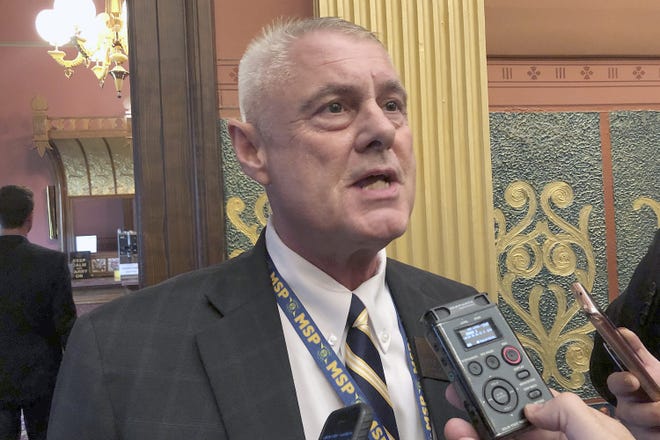 In this Sept. 3, 2019 file photo State Rep. Larry Inman, R-Williamsburg, speaks with reporters in the House chamber in Lansing. (AP Photo/David Eggert File)